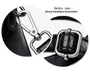Détail macro des attaches et boucles en argent brillant sur la bandoulière en cuir noir