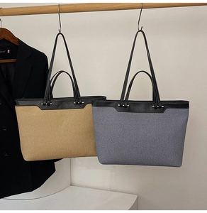 Detail of canvas tote bags in beige and denim blue with premium leather handles