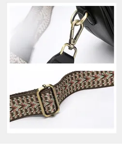 Detail of adjustable woven strap with vintage bronze lobster clasp on retro bag