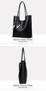Detail view of black tote bag featuring litchi texture and heart print silk scarf accessory