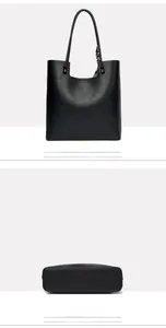 Detail view of large black leather tote bag back and base with textured finish