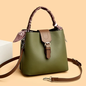 Deep green lychee pattern bucket bag with silk scarf handle and contrast strap