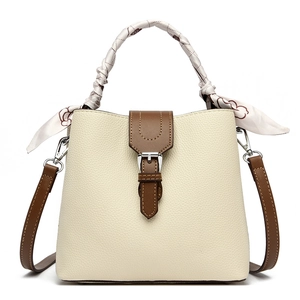 Litchi pattern bucket bag in beige leather with silk scarf handle and crossbody strap