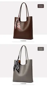 Detail of coffee and grey leather tote bags with heart pattern scarves and pebbled texture