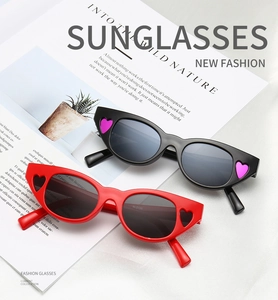 Detailed close-up of fashion cat-eye sunglasses with heart accents and item code RL5196
