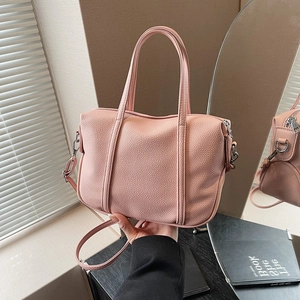 Pink lychee texture leather handbag with silver hardware and adjustable shoulder strap