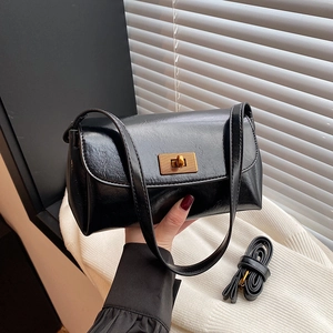 Retro black glossy shoulder bag with gold twist lock and adjustable long strap for women