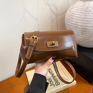 Vintage brown glossy oil wax leather crossbody bag with gold rectangular swivel lock