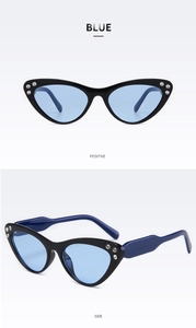 Dettaglio occhiali da sole cat eye con strass e lenti sfumate in azzurro chiaro