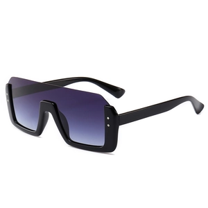 Trendige Oversize-Sonnenbrille mit einteiligen Verlaufsgläsern und stilvollen Nietendetails