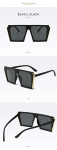 Detailed three-way view of oversized square black sunglasses with gold metal hinge accents