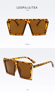 Detailed view of oversized leopard print sunglasses with tea lenses and gold metal hinges