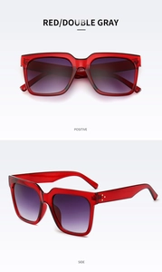 Detail of red translucent square sunglasses with gradient purple lenses and gold studs