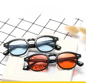 Detail of retro sunglasses showing silver arrow rivets and tinted transparent lenses