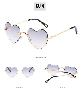 Detail of rimless heart sunglasses with faceted gradient lenses and textured gold temples