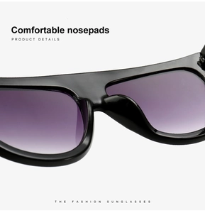 Gros plan sur les plaquettes de nez intégrées de lunettes de soleil noires oversize