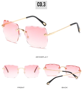 Detail of rimless square sunglasses with pink gradient lenses and wavy cut-edge design