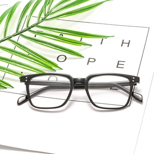 Retro black square frame eyeglasses with silver dot accents and clear lenses