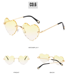Three-view layout showing yellow gradient heart-shaped rimless sunglasses with gold temples