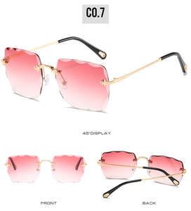 Frameless square sunglasses featuring pink gradient lenses with wave-cut edges and gold temples