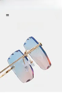 Detail of rimless square sunglasses with blue-pink gradient lenses and gold metal temples