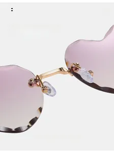 Close-up of comfortable nose pads on frameless heart-shaped gradient sunglasses