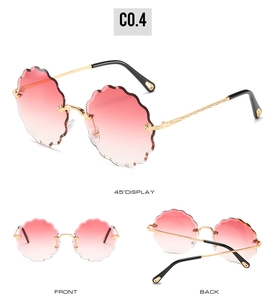Three-view display of rimless sunglasses with wavy petal lenses and floral metal temples