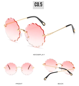 Three-way view of rimless sunglasses with pink gradient lenses and gold metal temples
