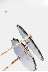 Detail of rimless flower cut lenses with light purple gradient and gold geometric temples
