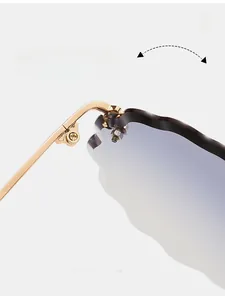 Detail of durable gold metal hinge on rimless gradient lens cloud sunglasses