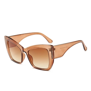 Stylish oversized cat eye sunglasses with gradient brown lenses and transparent tea frames