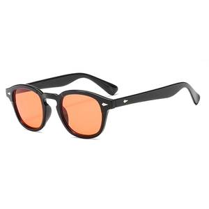 Classic retro sunglasses with black frames and orange lenses featuring silver rivets