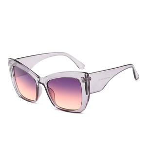 Stylish cat-eye sunglasses with transparent purple frames and orange-purple gradient lenses