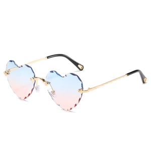 Frameless heart-shaped sunglasses with blue-pink gradient lenses and gold metal temples