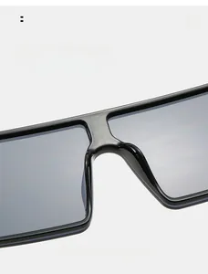Detail view of comfortable integrated nose pads on black oversized rimless sunglasses