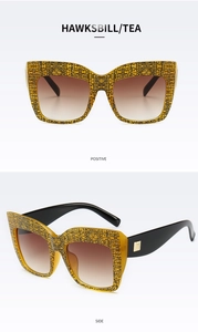 Detail of hawksbill square sunglasses with tea gradient lenses and metal hinges