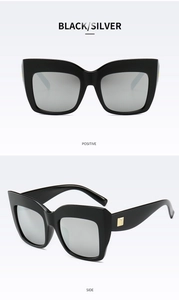 Front and side views of large frame cat-eye sunglasses with silver reflective lenses