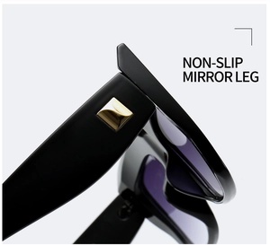 Detail of non-slip black sunglasses leg with square golden metal accent piece