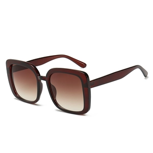 Classic oversized square sunglasses with burgundy translucent frames and brown gradient lenses