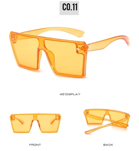 Detailed views of orange rimless square sunglasses with gradient lens and silver studs