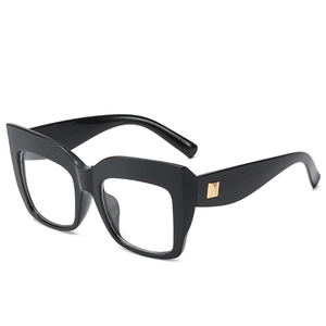 Oversized black square frame sunglasses with golden metal accents on wide temples