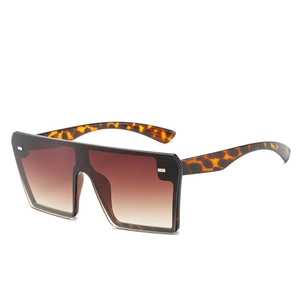 Frameless oversized gradient sunglasses with tortoise shell temples and metal rivets