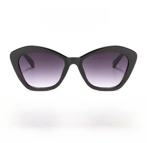 Detailed view of black cat-eye sunglasses with trendy purple gradient lenses