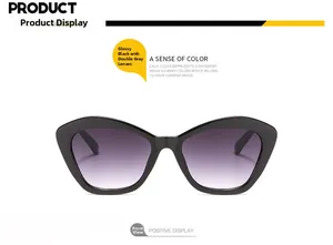Front view of stylish cat-eye sunglasses in bright black with double grey gradient lenses