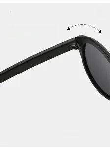 Detail of high-quality metal hinge construction on black matte large frame sunglasses