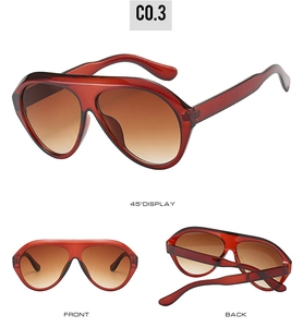 Multi-angle views of oversized translucent burgundy aviator sunglasses with brown gradient lenses