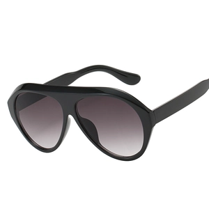 Fashionable oversized aviator sunglasses with black frames and grey gradient lenses