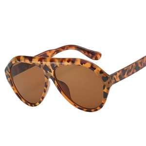 Oversized tortoise shell aviator sunglasses with brown tinted lenses on white background