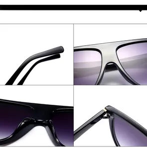 Détails de lunettes de soleil noires oversize avec verres dégradés violets et charnières