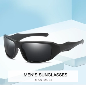 Detail view of matte black men's cycling sunglasses on a geometric platform